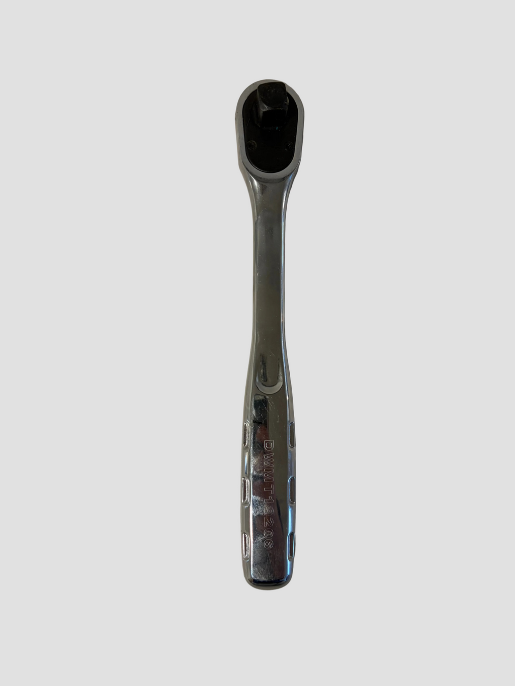 A chrome ratchet wrench with a black socket head, shown vertically on a light gray surface.