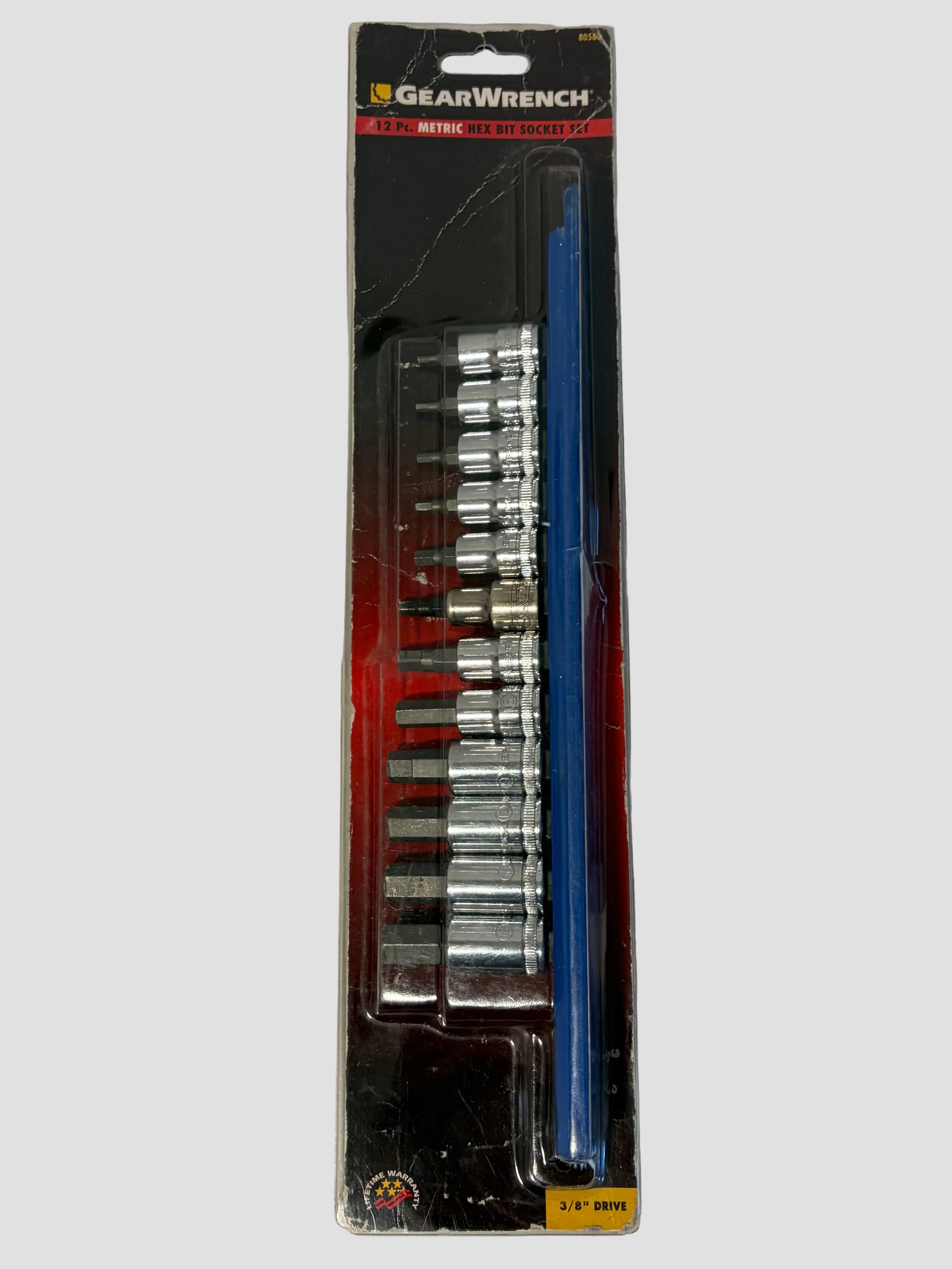 A GearWrench 10-piece socket set in its original retail blister packaging, featuring silver chrome sockets and a blue handle, photographed on a light gray surface.