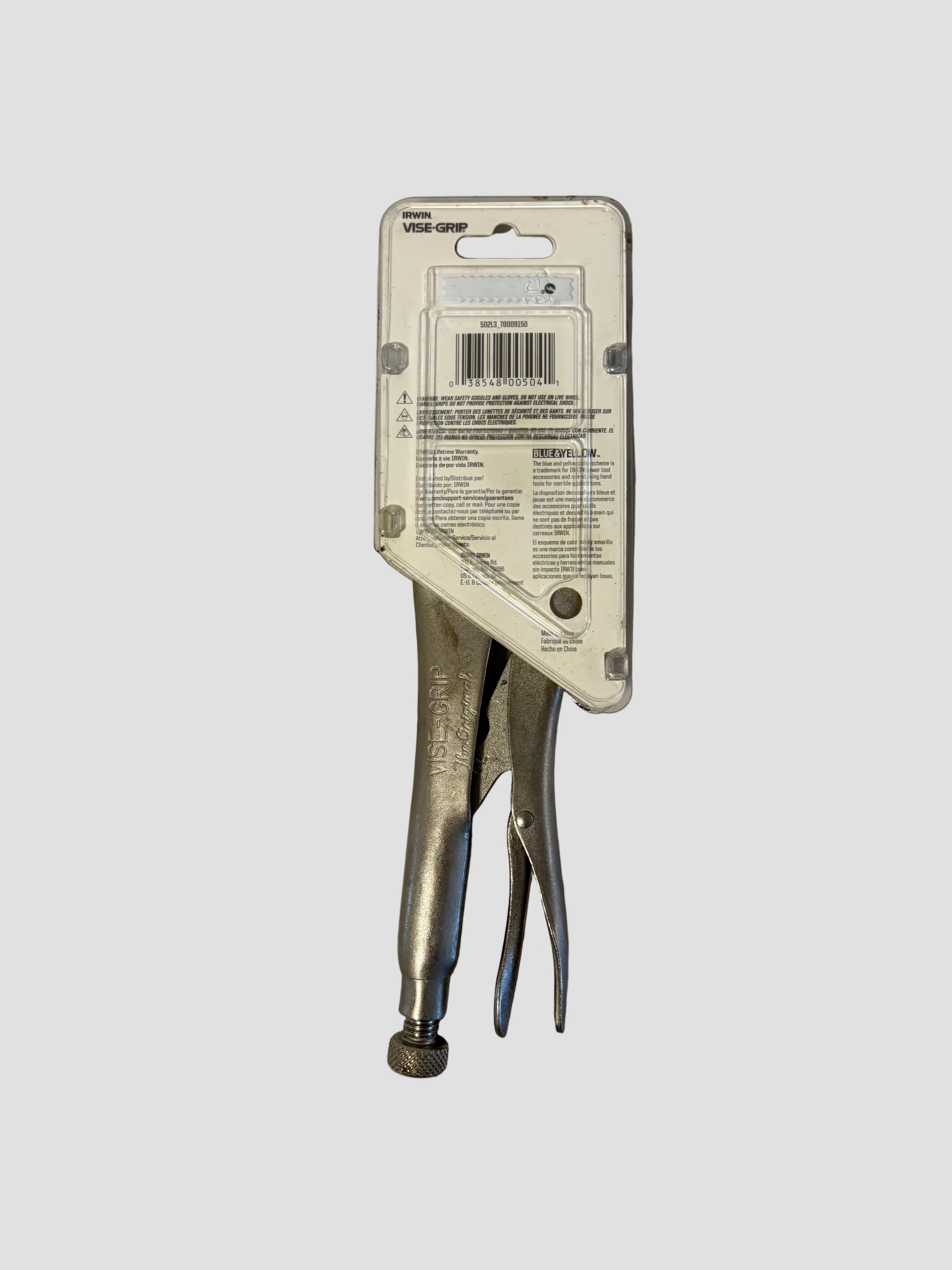 A vintage-style metal clamp tool in its original white cardboard retail packaging, photographed against a plain gray background.