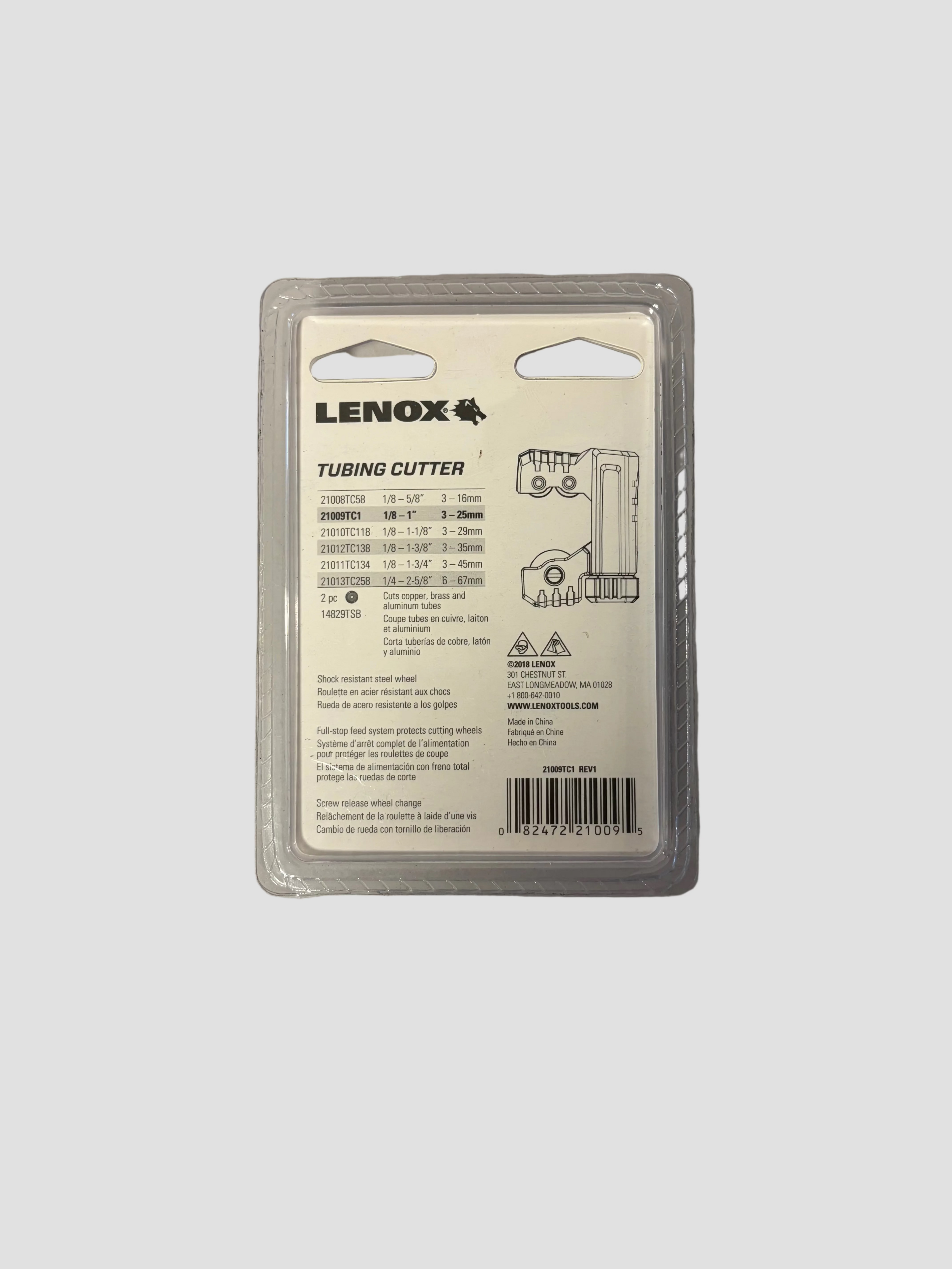 Lenox tubing cutter in clear plastic retail packaging, photographed on a plain light gray surface.