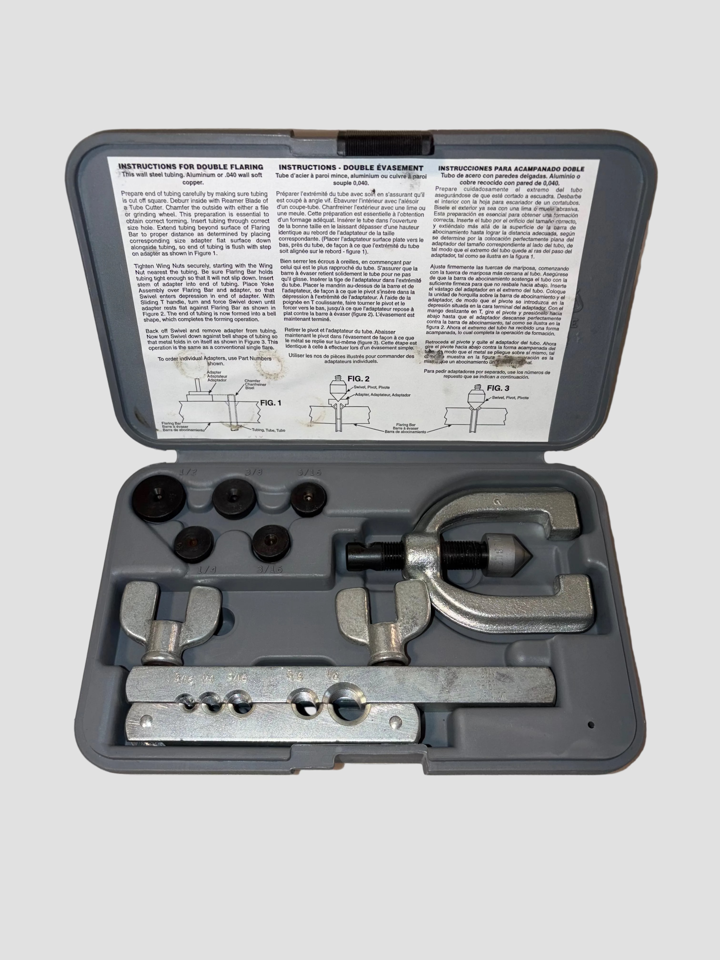 Tool kit with components and instructions on a light gray background