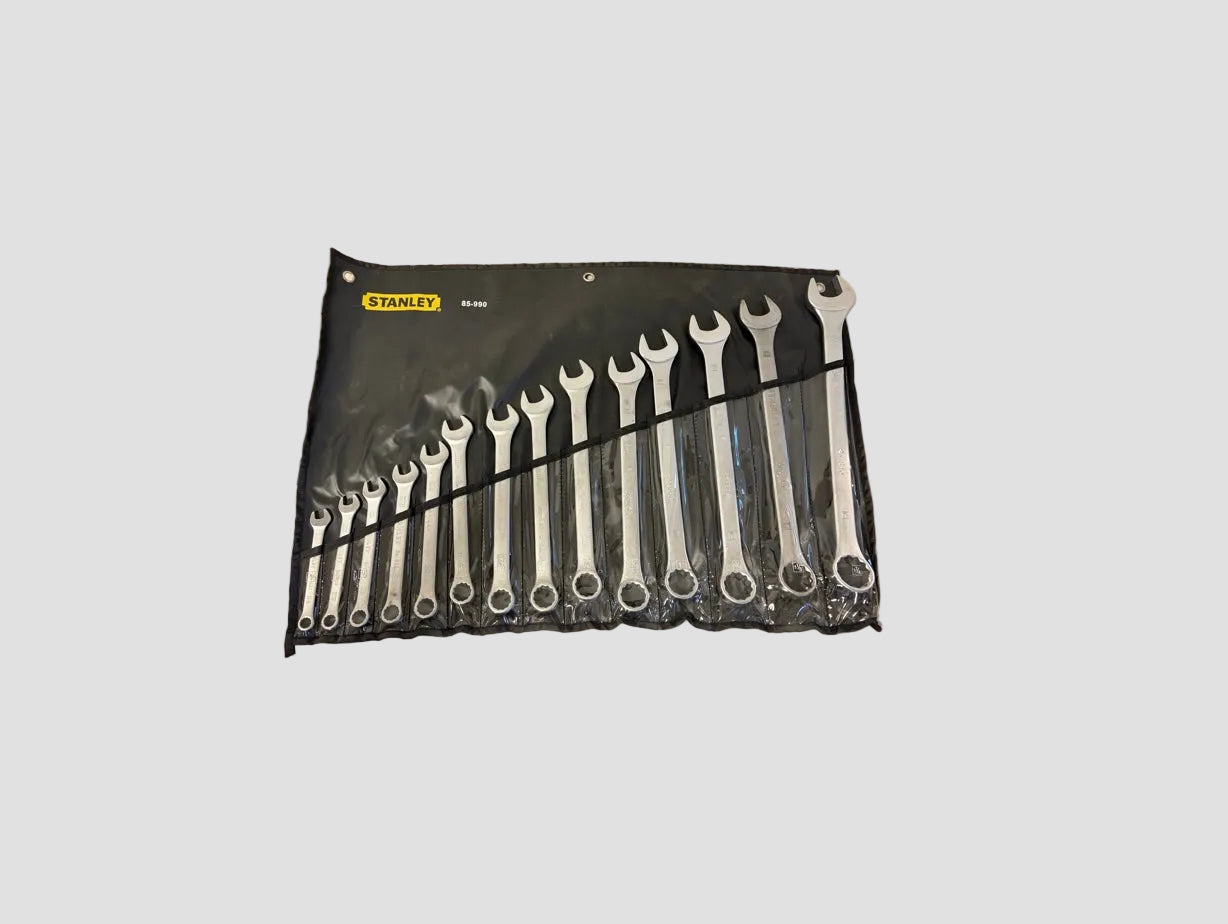 A set of 14 Stanley combination wrenches in varying sizes, neatly arranged inside a black plastic and canvas roll-up tool pouch. The yellow and black Stanley logo is visible in the top left corner of the pouch.