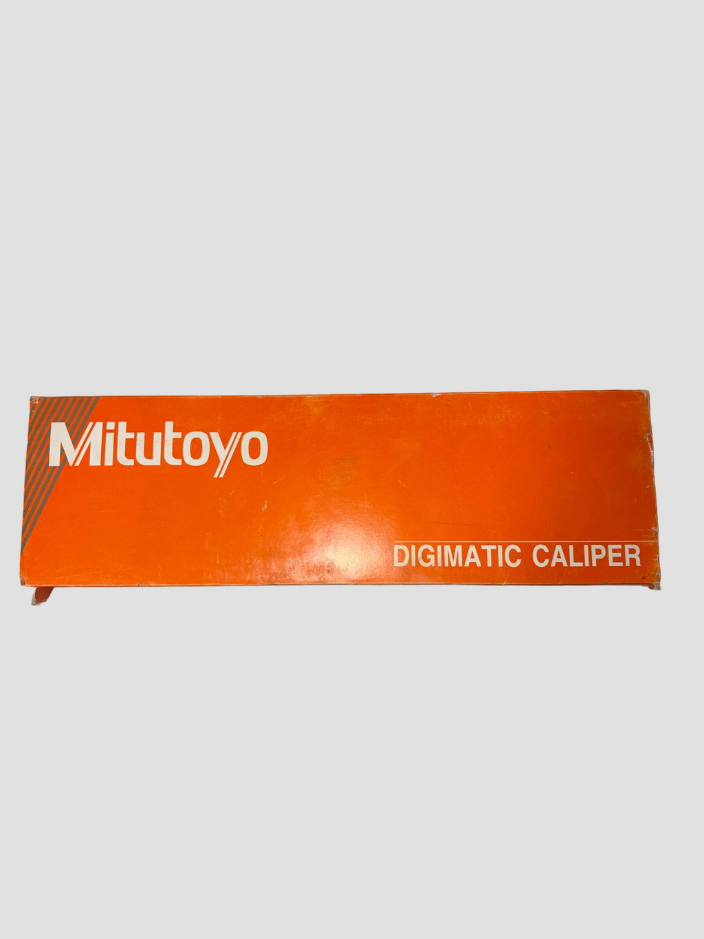 Orange Mitutoyo Digimatic Caliper box on a white background