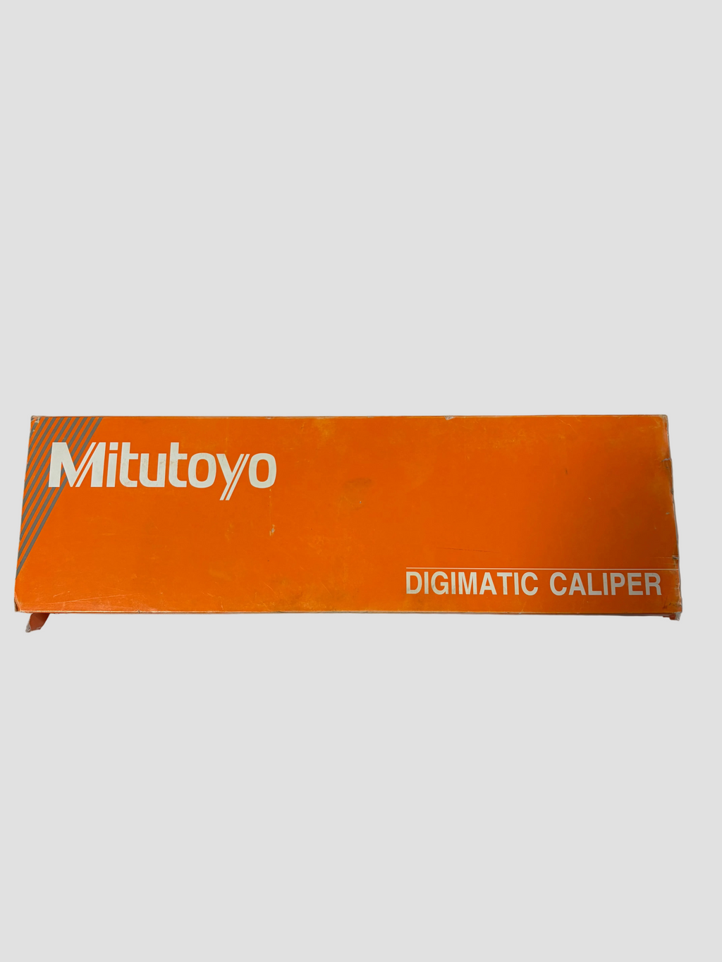 Orange Mitutoyo Digimatic Caliper box on a white background