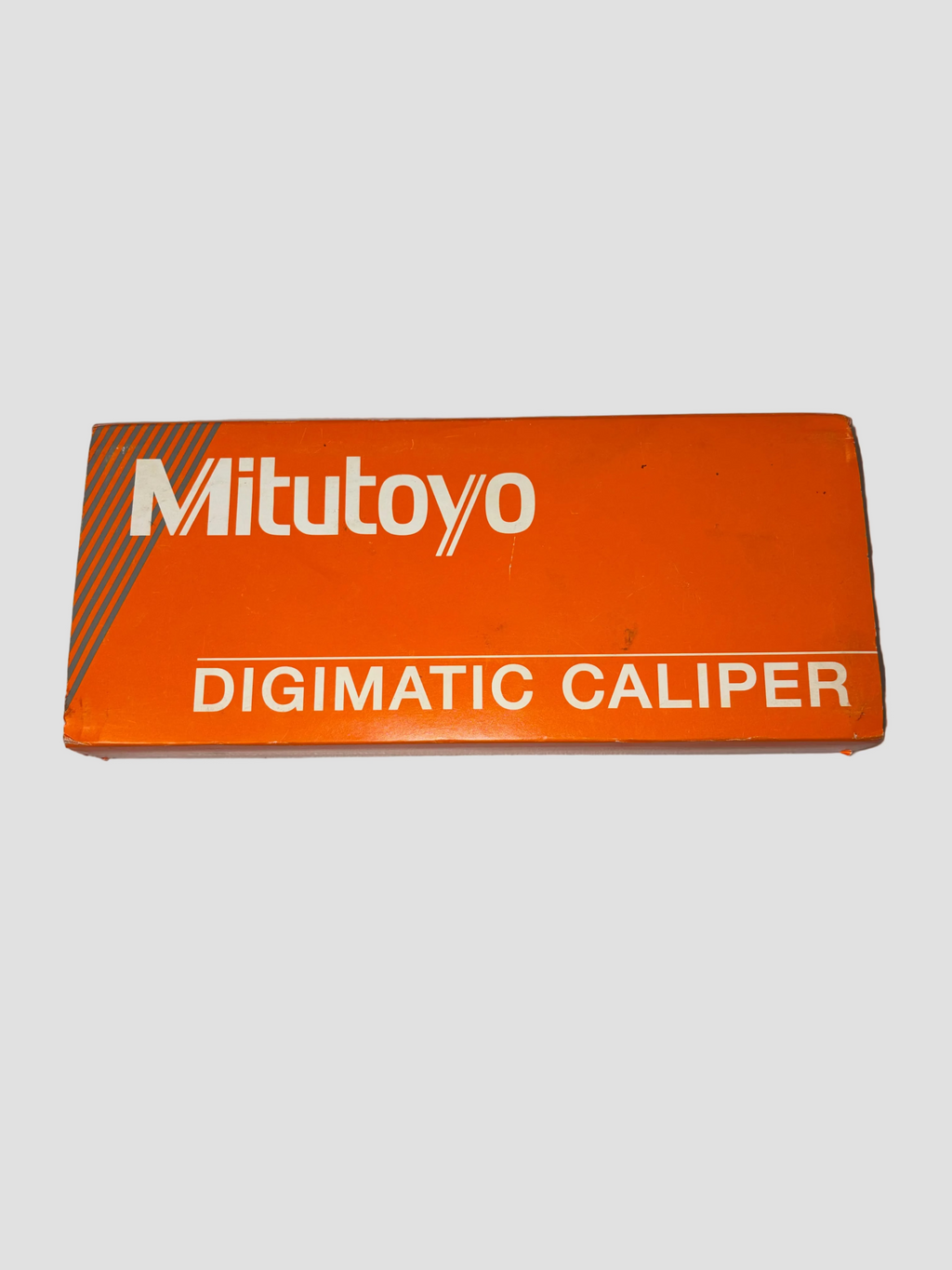 Orange Mitutoyo Digimatic Caliper box on a white background